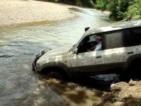 Toyota off-road vehicle attempting to ford a stream in Nicaragua – Best Places In The World To Retire – International Living